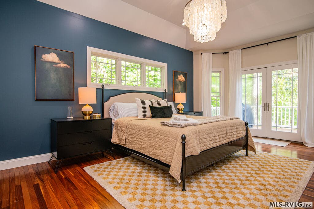 Primary Suite – Lakeside Living , Another beautiful view of the spacious primary suite, with hardwood floors and French doors opening directly to the lakeside deck for your own private outdoor escape. - 243 Woodland Rd, Littleton NC 27850, Littleton