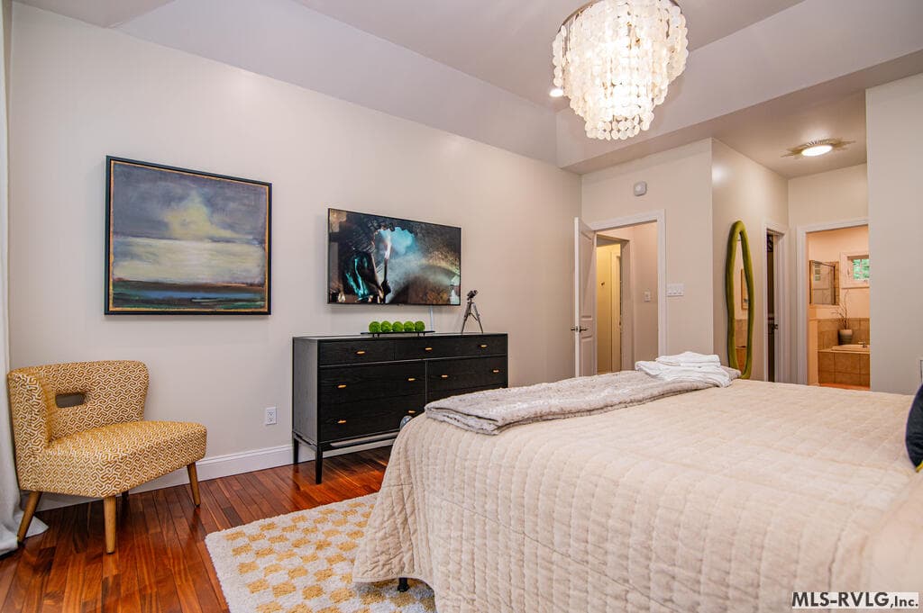 Downstairs Flex Room – Currently Used as a Bedroom, Spacious and relaxing, featuring a soft accent wall, ceiling fan, and a prime downstairs location by the lakeside.e - 243 Woodland Rd, Littleton NC 27850, Littleton
