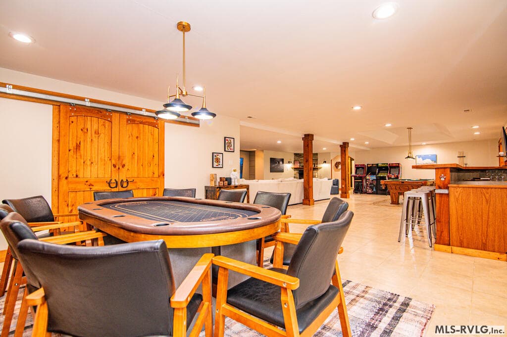 Charming Lower-Level Bathroom, Charming lower-level bathroom with warm wood accents, vessel sink and walk-in shower—conveniently located near the game and entertainment areas. - 243 Woodland Rd, Littleton NC 27850, Littleton