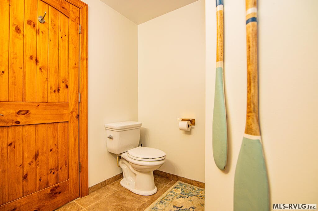 Downstairs Full bathroom, Charming lower-level bathroom with warm wood accents, vessel sink and walk-in shower—conveniently located near the game and entertainment areas. - 243 Woodland Rd, Littleton NC 27850, Littleton