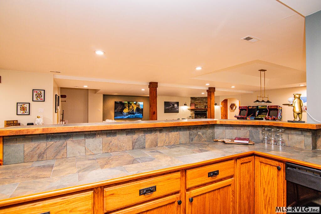 Bar & Refrigerator Area, Full-size refrigerator adds convenience to this impressive lower-level entertaining space - 243 Woodland Rd, Littleton NC 27850, Littleton