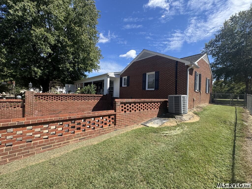Brick accents define the flower garden - 2709 Ankum Rd., Gasburg VA 23857, Gasburg